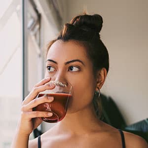 Young woman drinking a beverage