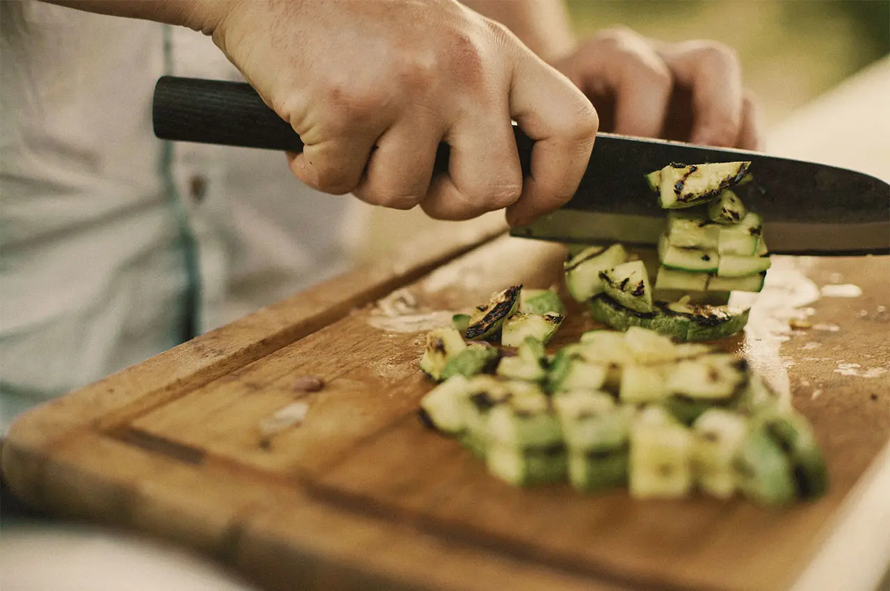 Cutting grilled courgette