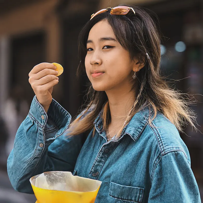Girl eating crisps