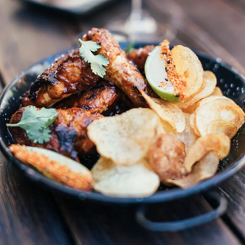 Plate with grilled meat and crisps