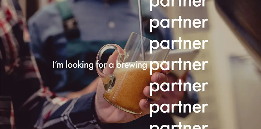 Hand pouring beer from tap with “I’m looking for a brewing partner” written on top