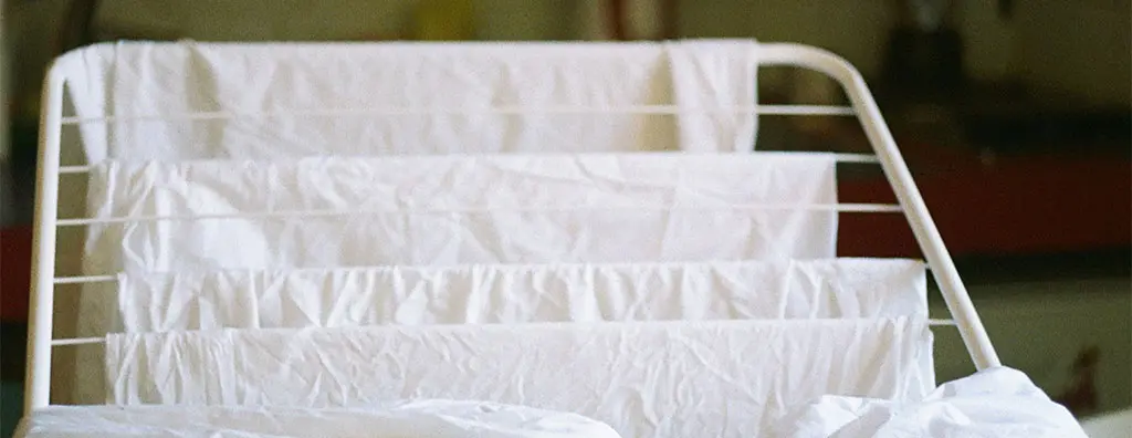 Clothes rack with white laundry
