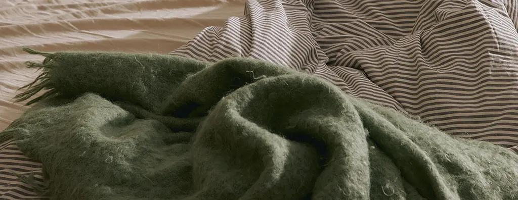 Bed linen casually placed on a bed
