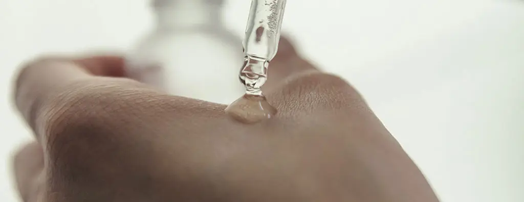 A drop on a hand from a pipette