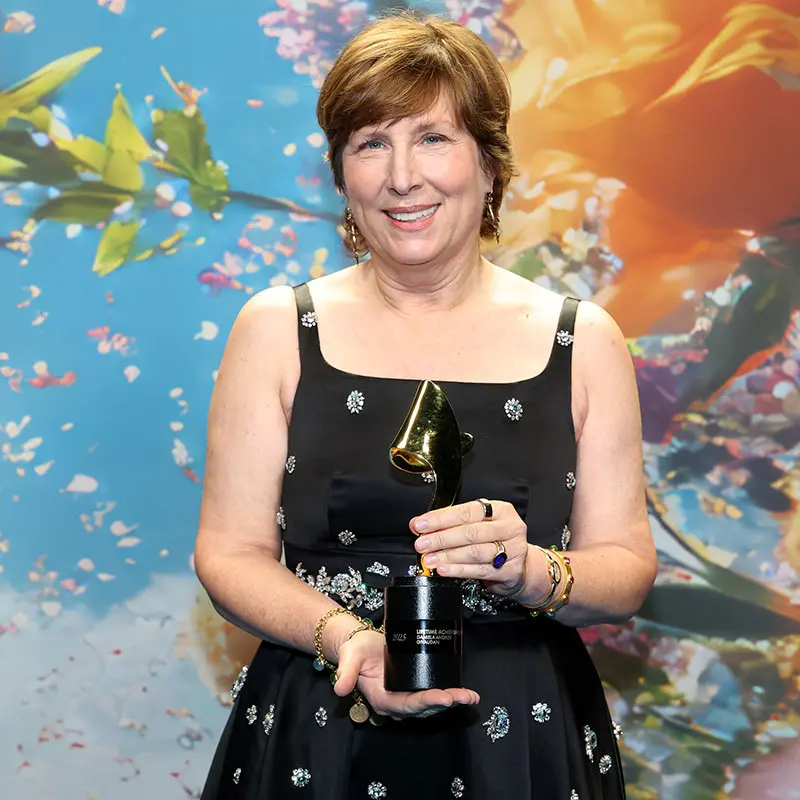 Daniela Andrier holding the Lifetime Achievement Perfumer Award at the TFF event in New York City