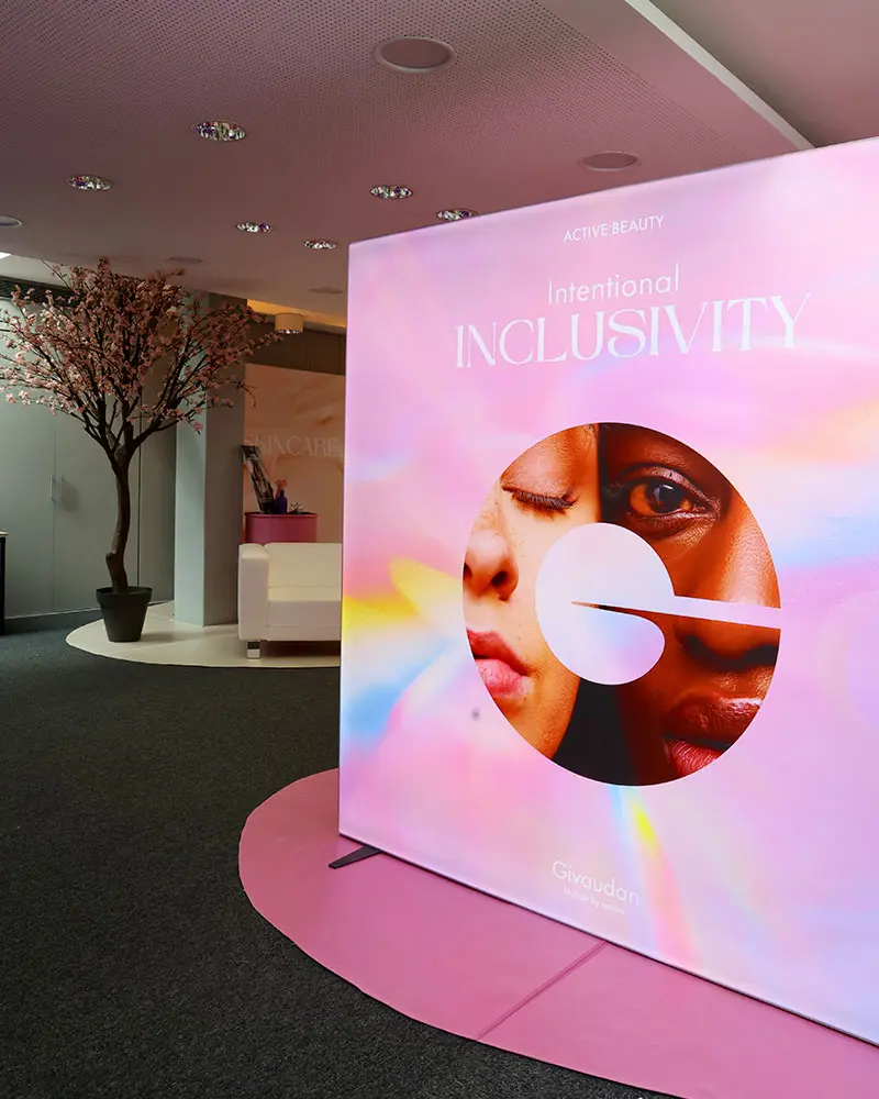 Exhibition about inclusivity showing a big pink poster