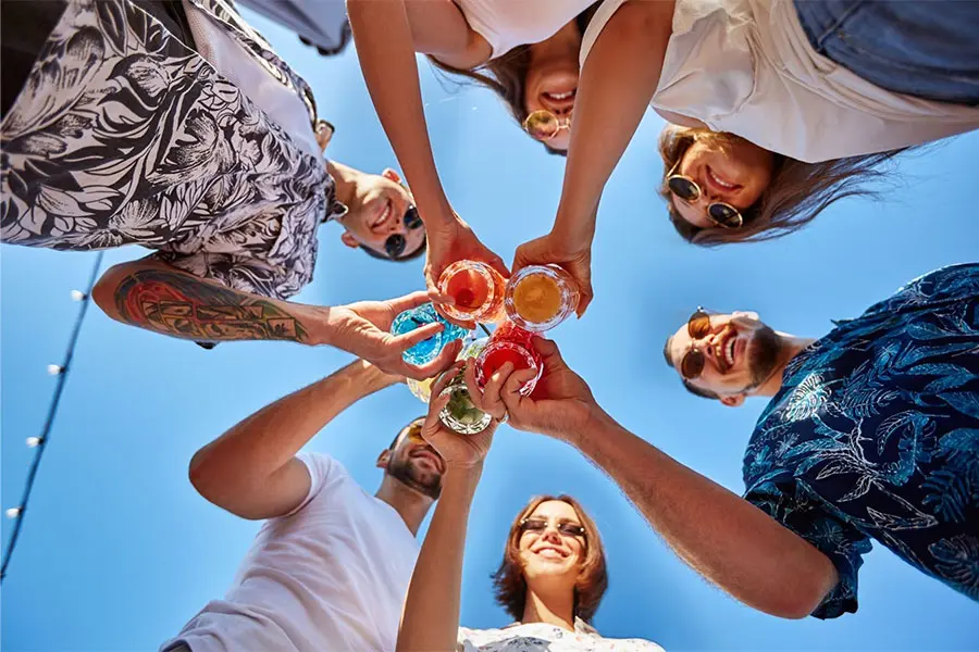 A group of people clinking glasses