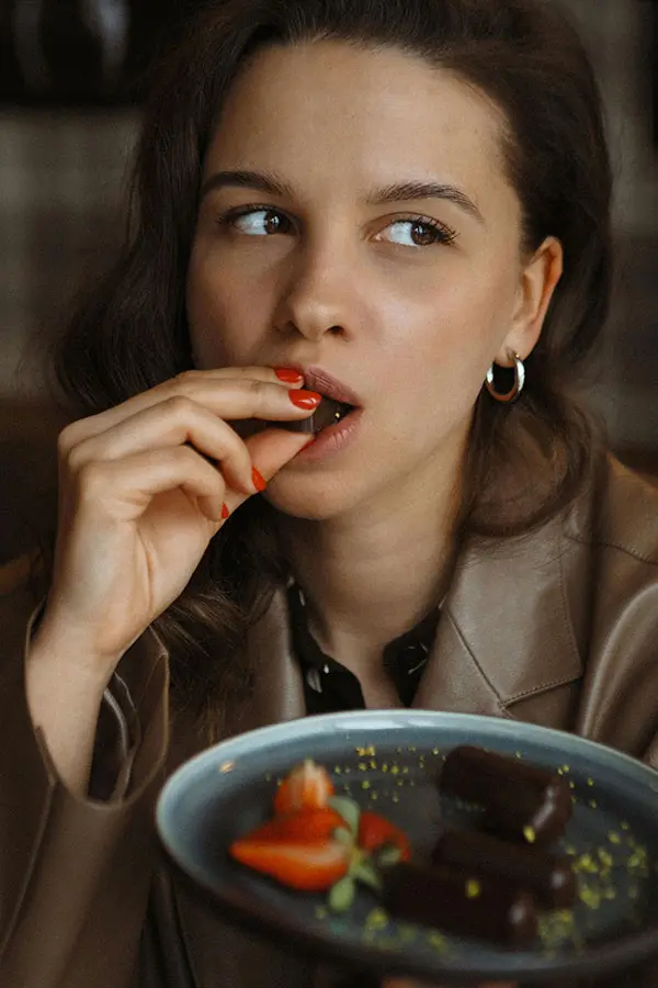 A woman enjoying a chocolate