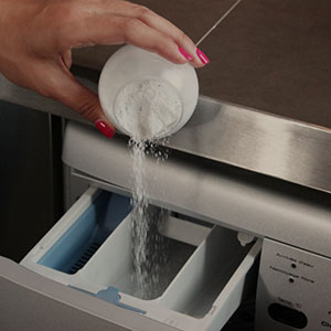 Adding washing powder to washing machine