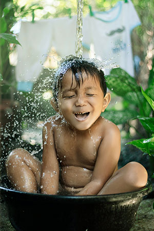 Young boy in a bath tub