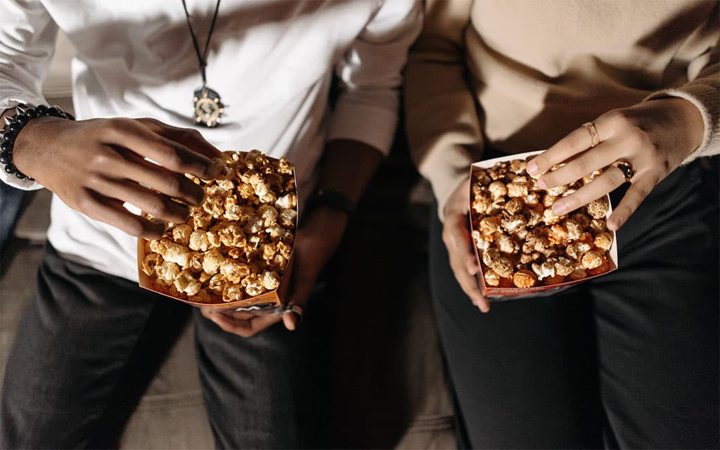 Couple eating popcorn