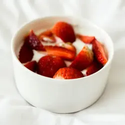A bowl of strawberries and cream