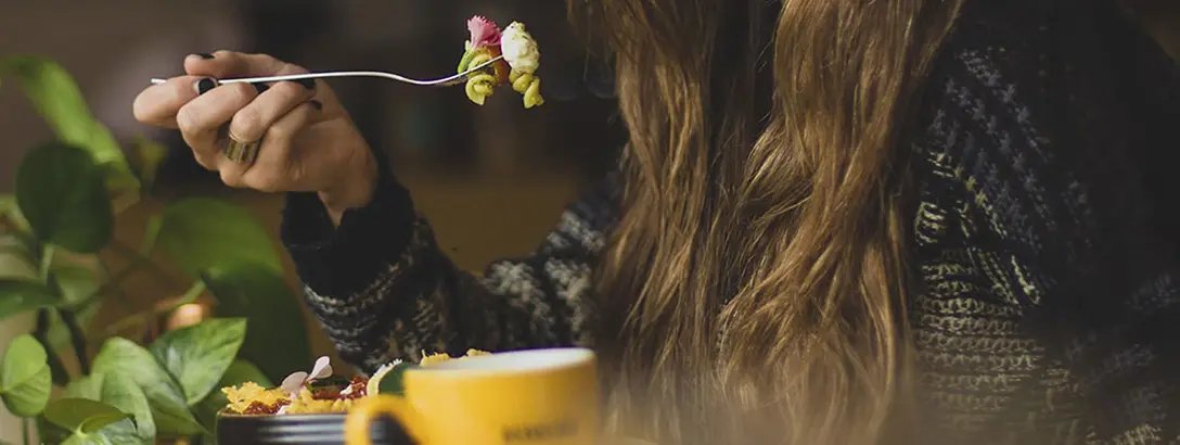 Woman eating pasta