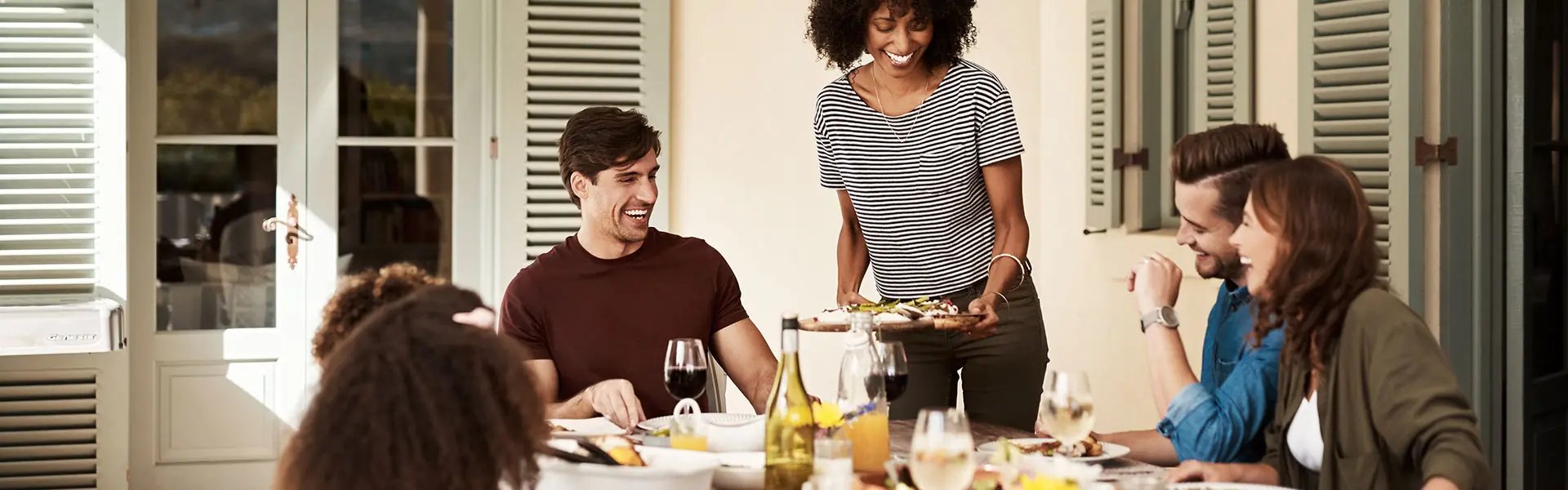 Love, family and laughter; shot of a group of people sharing a meal