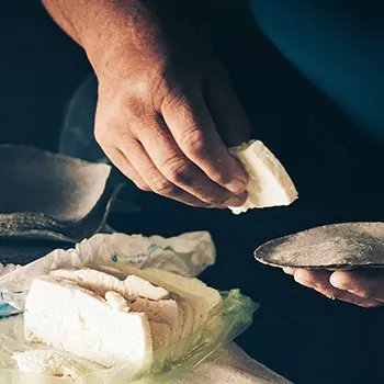 Adding a slice of cheese on tortilla