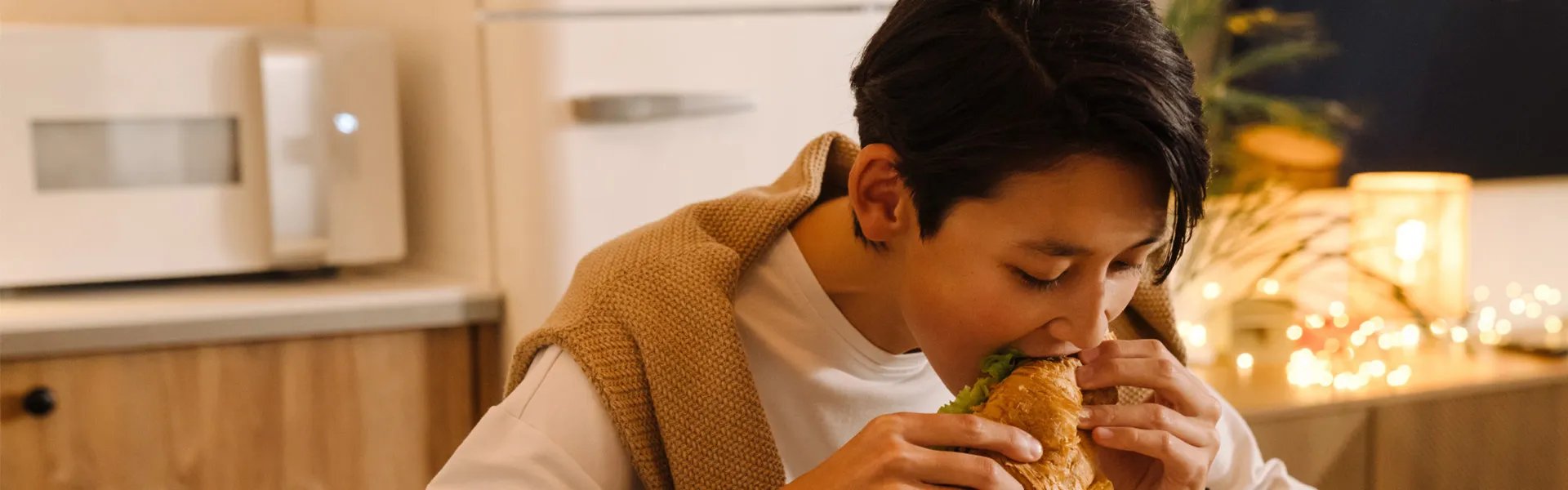Lady eating sandwich