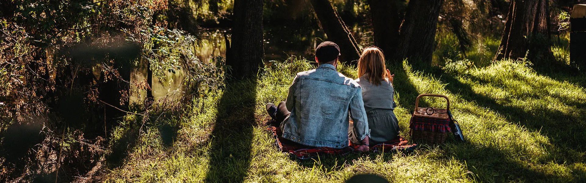 Couple having a picnic in the forest