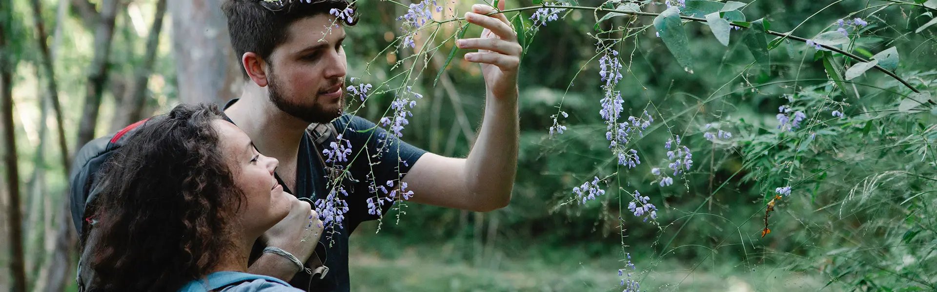 Couple smelling flowers