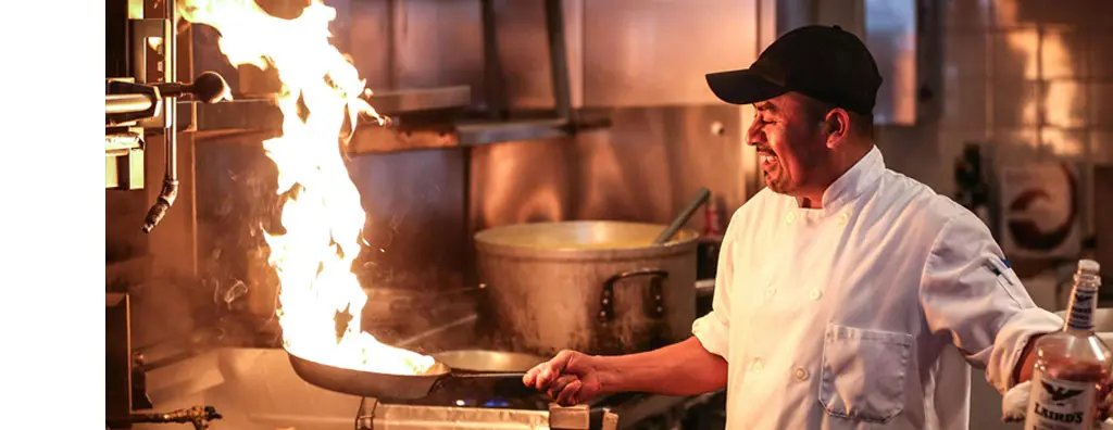 Chef cooking with fire