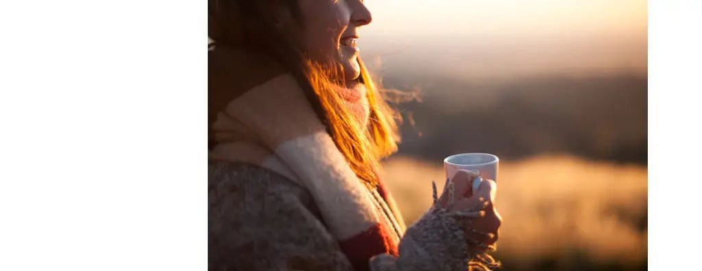 Drinking coffee during sunset