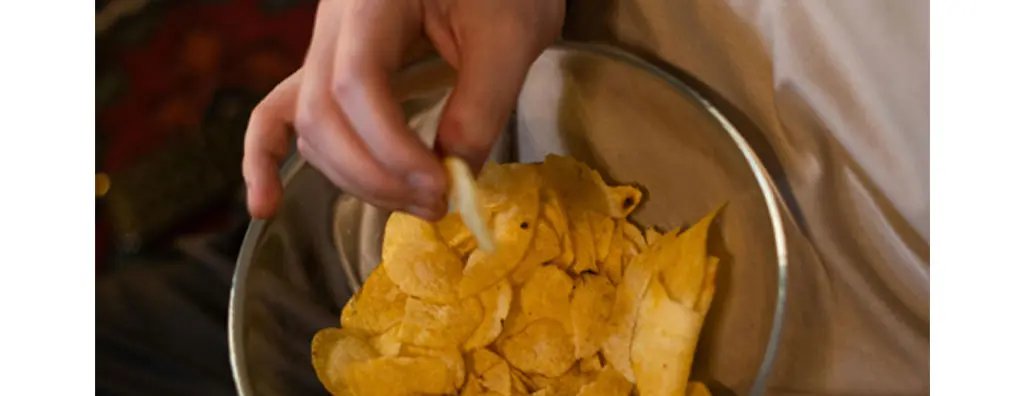 Eating crisps from a bowl