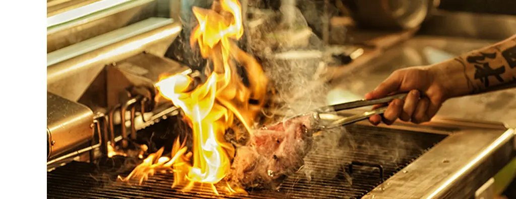 Grilling meat on a barbeque