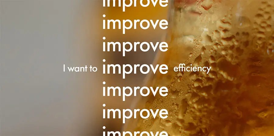 Close up of chilled beer glass with “I want to improve efficiency” written on top