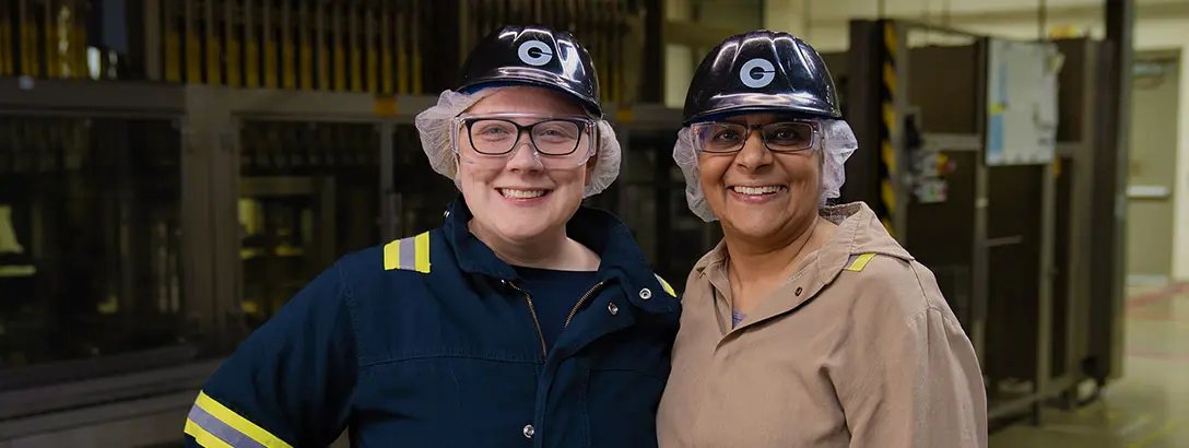 Two Givaudan employees wearing protective gear