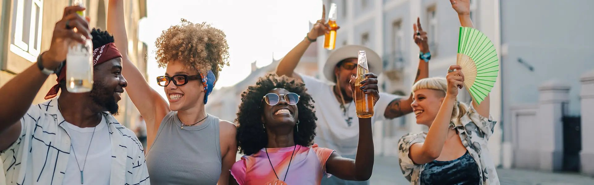 A group of people holding drinks