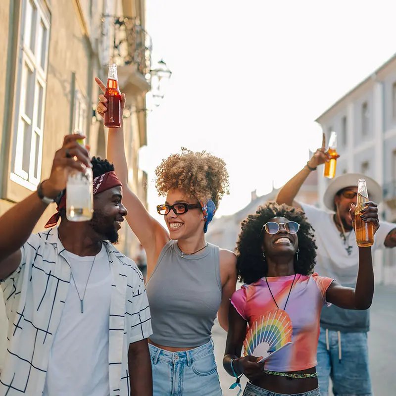 A group of people holding drinks