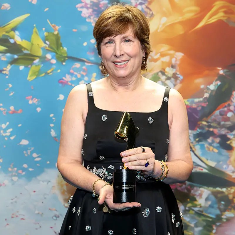 Daniela Andrier holding the Lifetime Achievement Perfumer Award at the TFF event in New York City
