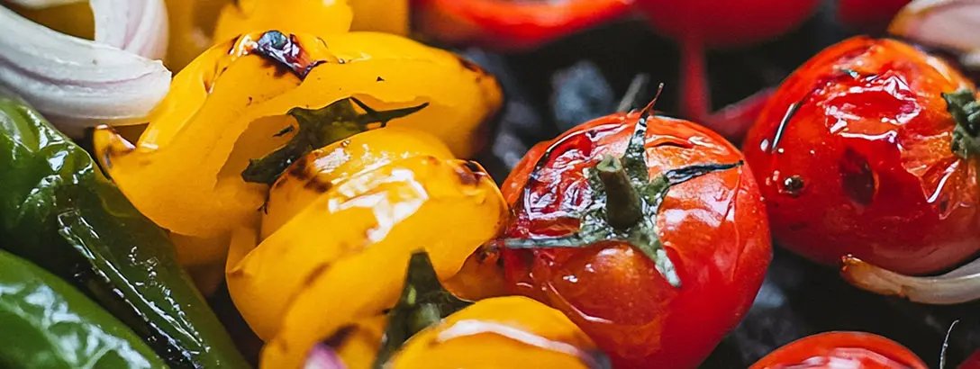 Grilled green pepper, yellow bell pepper and tomatos