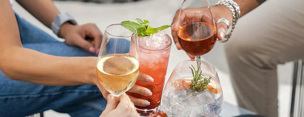 Toasting with different kind of drinks like beer, wine, beverages