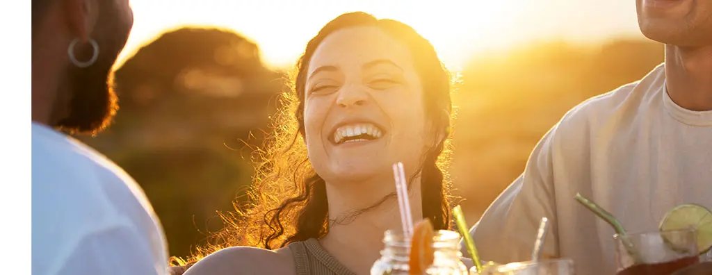 Young woman enjoying a beverage with straws