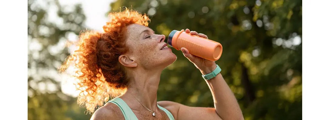 Woman drinking sports drink