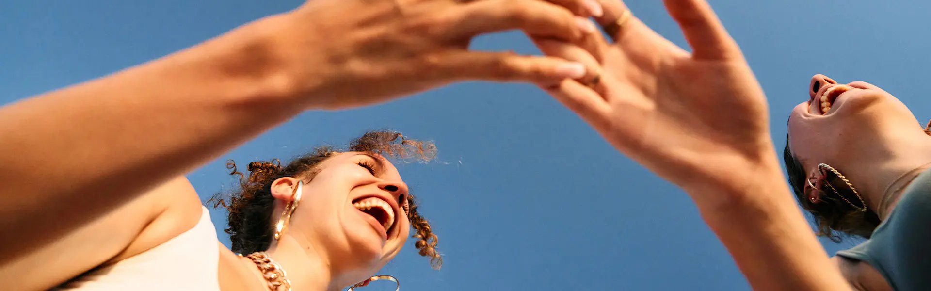 Two women touching each others hands